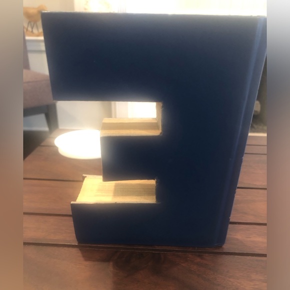 Anthropologie: Hand cut letters from Reader’s Digest books. Spells out “HOME.” - Picture 15 of 15